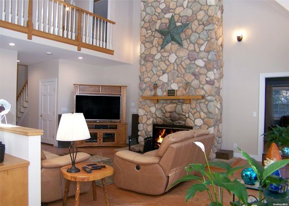 Fireplace, Interior, Living room, Recessed Lighting, Stone Walls, Wood Texture Flooring