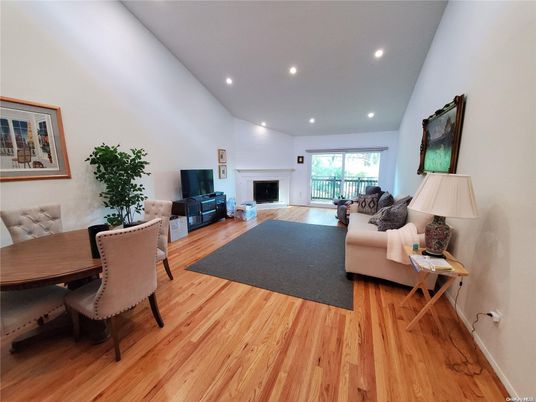 Dining room, Fireplace, Interior, Living room, Recessed Lighting, Wood Texture Flooring
