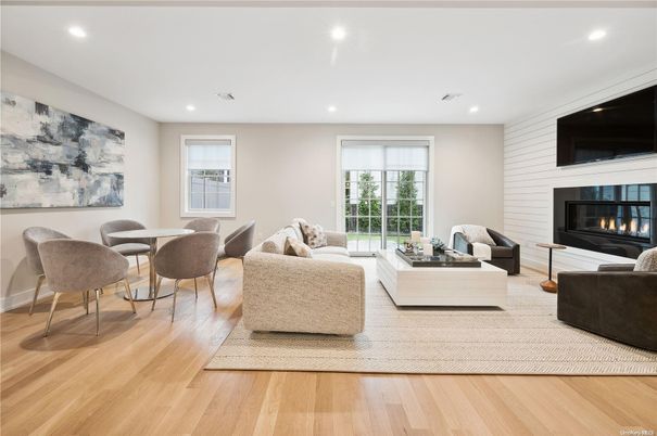 Dining room, Fireplace, Interior, Living room, Recessed Lighting, Wood Texture Flooring
