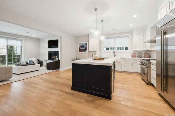 Fireplace, Interior, Kitchen, Living room, Pendant Lights, Recessed Lighting, Stainless Steel Appliances, Wood Texture Flooring