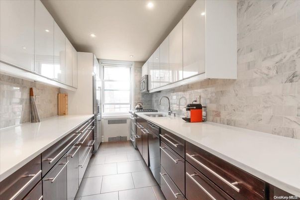 Interior, Kitchen, Marble Walls, Recessed Lighting, Stainless Steel Appliances