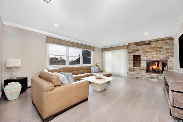 Fireplace, Interior, Living room, Recessed Lighting, Stone Walls, Wood Texture Flooring