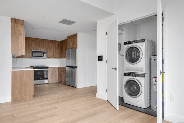 Interior, Kitchen, Recessed Lighting, Utility Closets, Washer, Wood Texture Flooring
