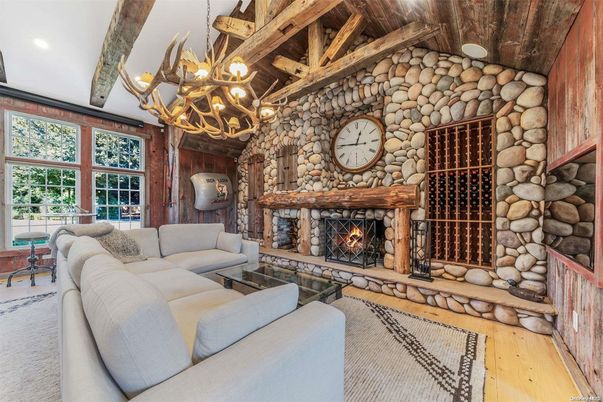 Chandelier, Fireplace, Interior, Living room, Recessed Lighting, Stone Walls, Wooden Beams, Wood Texture Flooring