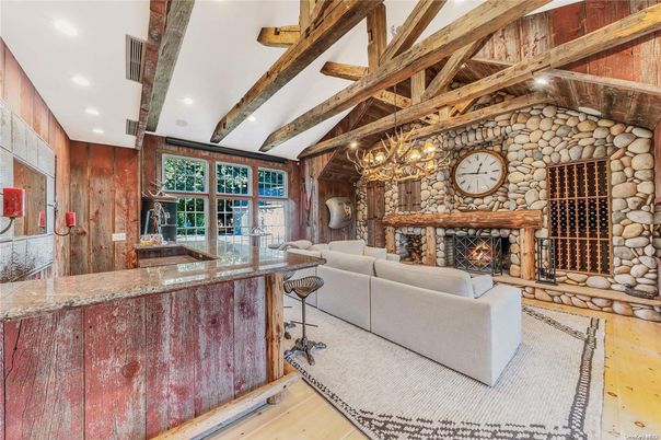 Chandelier, Fireplace, Interior, Living room, Recessed Lighting, Stone Walls, Wooden Beams, Wood Texture Flooring