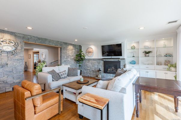 Fireplace, Interior, Living room, Recessed Lighting, Stone Walls, Wood Texture Flooring