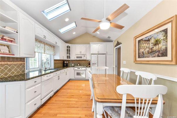 Dining room, Interior, Kitchen, Recessed Lighting, Stainless Steel Appliances, Wood Texture Flooring