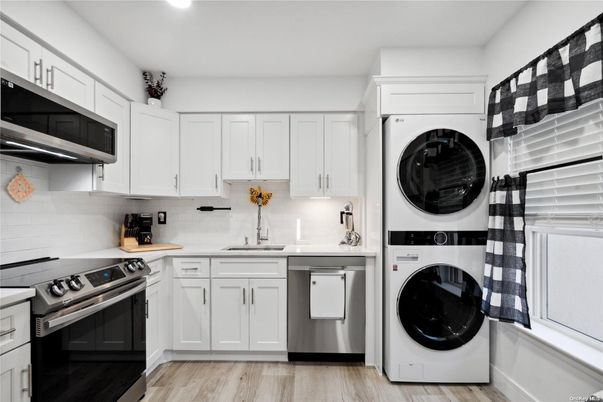 Interior, Kitchen, Recessed Lighting, Stainless Steel Appliances, Washer, Wood Texture Flooring