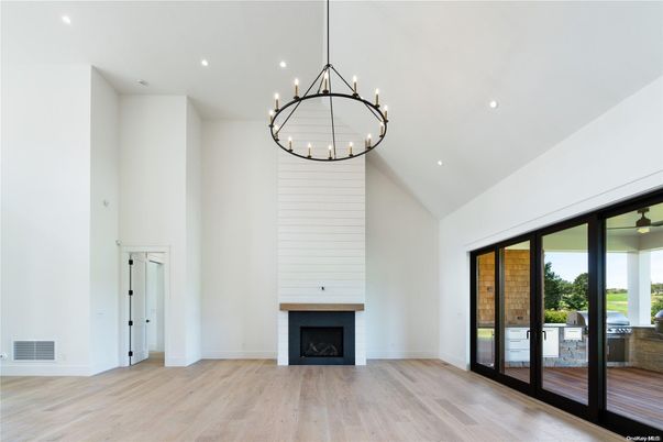 Chandelier, Empty room, Fireplace, Interior, Pendant Lights, Recessed Lighting, Wood Texture Flooring