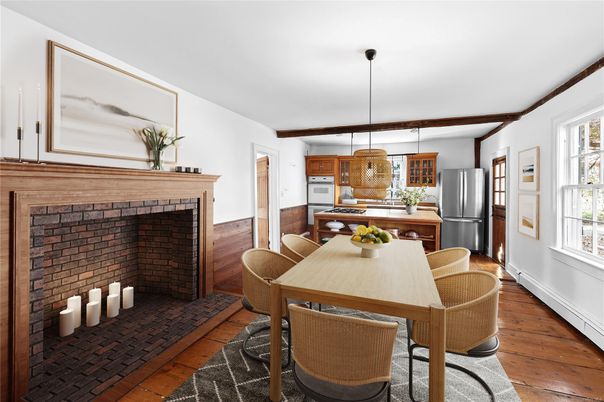 Dining room, Fireplace, Interior, Kitchen, Pendant Lights, Stainless Steel Appliances, Wood Texture Flooring