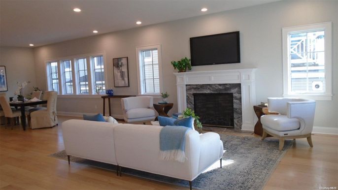 Dining room, Fireplace, Interior, Living room, Recessed Lighting, Wood Texture Flooring