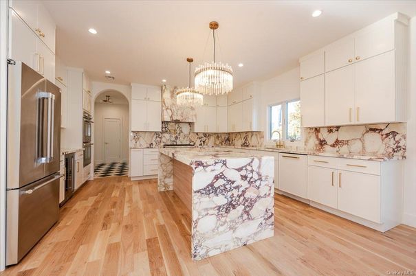 Chandelier, Interior, Kitchen, Pendant Lights, Recessed Lighting, Stainless Steel Appliances, Wood Texture Flooring