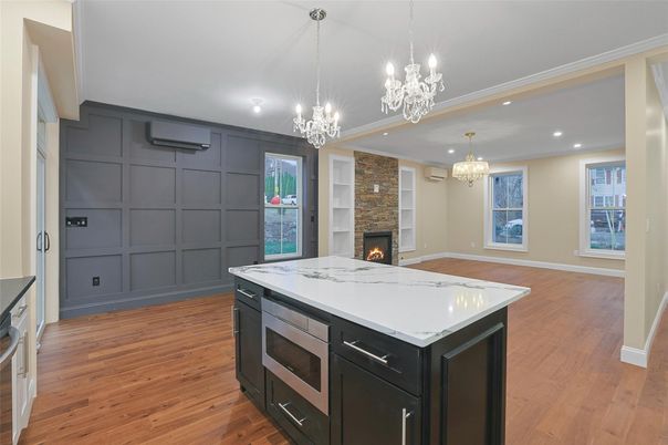 Chandelier, Fireplace, Interior, Kitchen, Pendant Lights, Recessed Lighting, Wood Texture Flooring