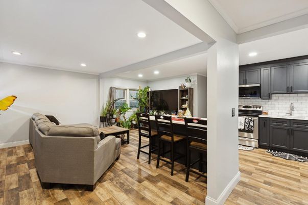 Dining room, Interior, Kitchen, Living room, Recessed Lighting, Stainless Steel Appliances, Wood Texture Flooring