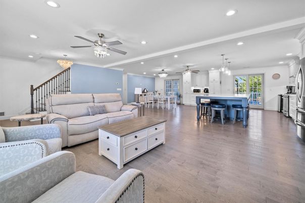 Chandelier, Dining room, Interior, Kitchen, Living room, Pendant Lights, Recessed Lighting, Stainless Steel Appliances, Wood Texture Flooring