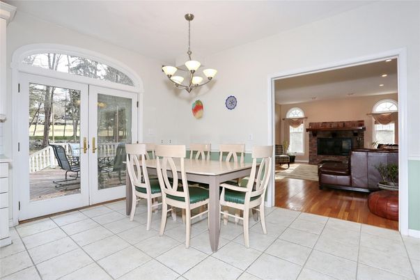 Chandelier, Dining room, Fireplace, Interior, Living room, Recessed Lighting, Wood Texture Flooring