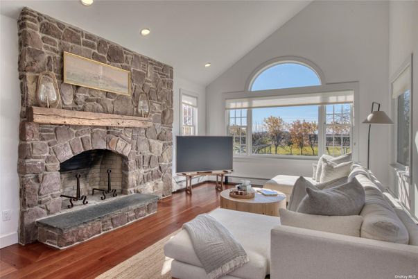 Fireplace, Interior, Living room, Recessed Lighting, Stone Walls, Wood Texture Flooring