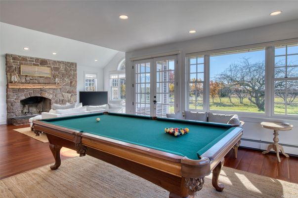 Billiard Table, Fireplace, Game Room, Interior, Recessed Lighting, Stone Walls, Wood Texture Flooring