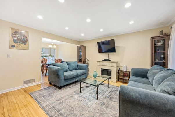 Chandelier, Dining room, Fireplace, Interior, Living room, Recessed Lighting, Wood Texture Flooring