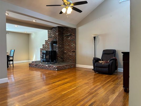 Fireplace, Interior, Recessed Lighting, Stone Walls, Wood Texture Flooring