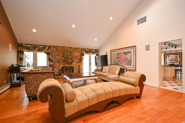 Fireplace, Interior, Living room, Recessed Lighting, Stone Walls, Wood Texture Flooring