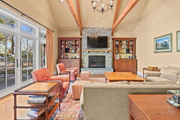 Chandelier, Fireplace, Interior, Living room, Recessed Lighting, Stone Walls, Wooden Beams, Wood Texture Flooring