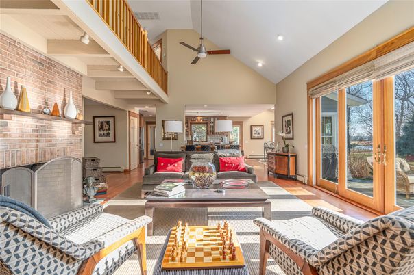 Fireplace, Interior, Living room, Recessed Lighting, Stone Walls, Wood Texture Flooring