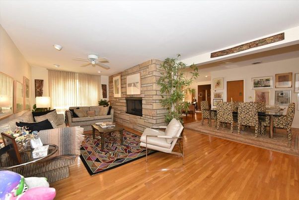 Dining room, Fireplace, Interior, Living room, Recessed Lighting, Stone Walls, Wood Texture Flooring