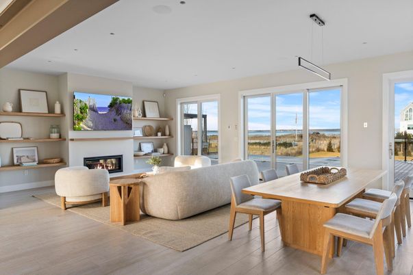 Dining room, Fireplace, Interior, Living room, Pendant Lights, Recessed Lighting, Water, Wood Texture Flooring