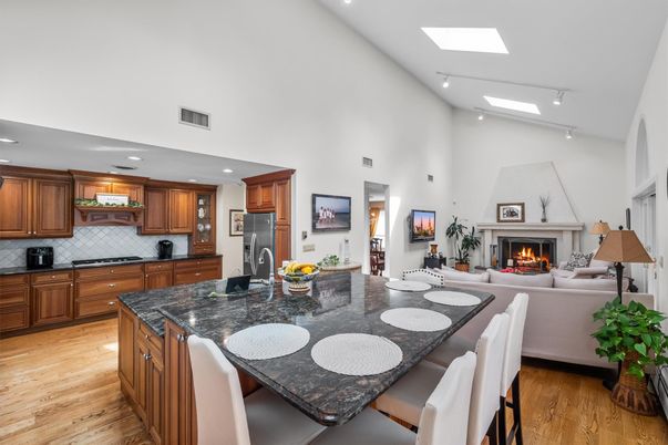 Dining room, Fireplace, Interior, Kitchen, Living room, Recessed Lighting, Stainless Steel Appliances, Wood Texture Flooring