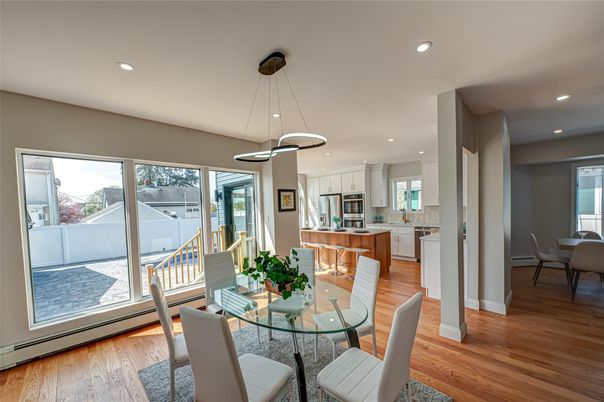 Dining room, Interior, Kitchen, Pendant Lights, Recessed Lighting, Stainless Steel Appliances, Wood Texture Flooring
