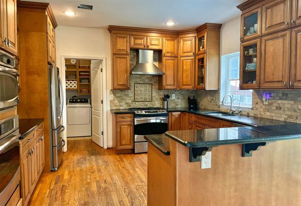 Interior, Kitchen, Recessed Lighting, Stainless Steel Appliances, Washer, Wood Texture Flooring