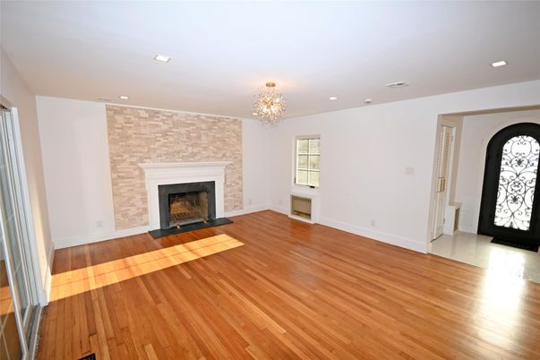 Chandelier, Empty room, Fireplace, Interior, Recessed Lighting, Wood Texture Flooring