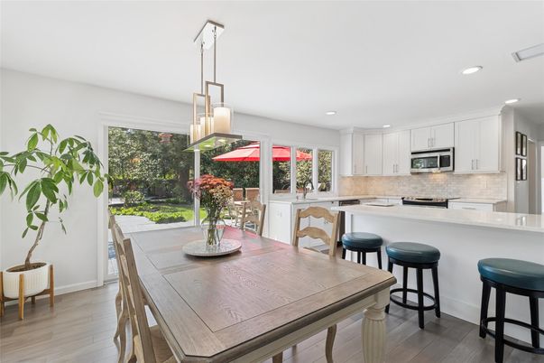 Dining room, Interior, Kitchen, Pendant Lights, Recessed Lighting, Stainless Steel Appliances, Wood Texture Flooring