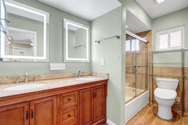 Bathroom, Dual Sink Vanities, Glass Shower, Interior, Wood Texture Flooring
