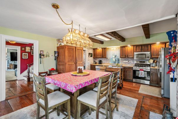 Chandelier, Dining room, Interior, Kitchen, Stainless Steel Appliances, Wooden Beams, Wood Texture Flooring