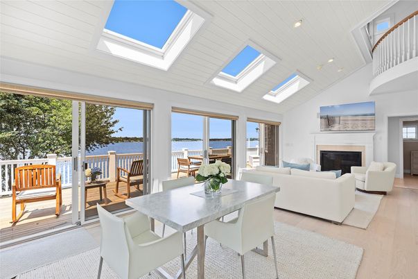 Dining room, Fireplace, Interior, Living room, Recessed Lighting, Water, Wood Texture Flooring