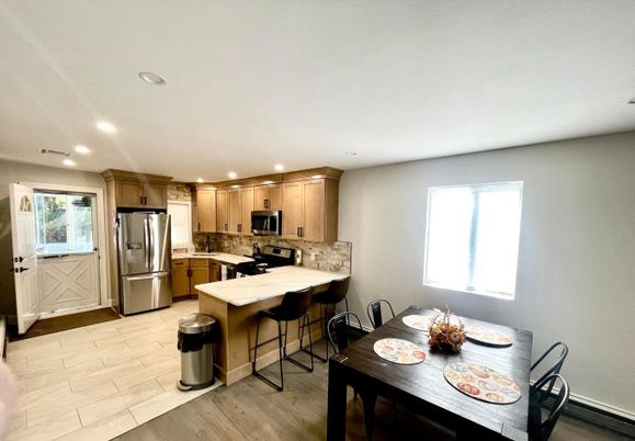 Dining room, Interior, Kitchen, Recessed Lighting, Stainless Steel Appliances, Wood Texture Flooring