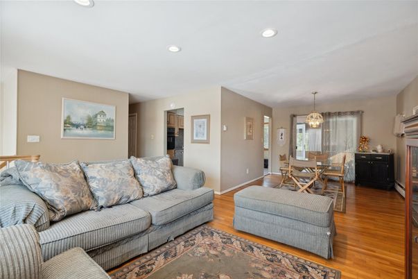 Chandelier, Dining room, Fireplace, Interior, Living room, Recessed Lighting, Wood Texture Flooring