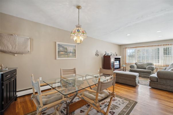 Dining room, Fireplace, Interior, Living room, Pendant Lights, Recessed Lighting, Wood Texture Flooring