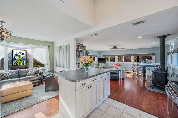 Dining room, Fireplace, Interior, Kitchen, Living room, Recessed Lighting, Wood Texture Flooring