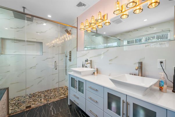 Bathroom, Dual Sink Vanities, Glass Shower, Interior, Marble, Marble Walls, Recessed Lighting