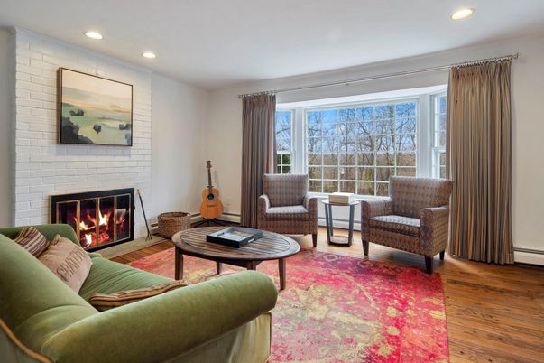 Fireplace, Interior, Living room, Recessed Lighting, Stone Walls, Wood Texture Flooring