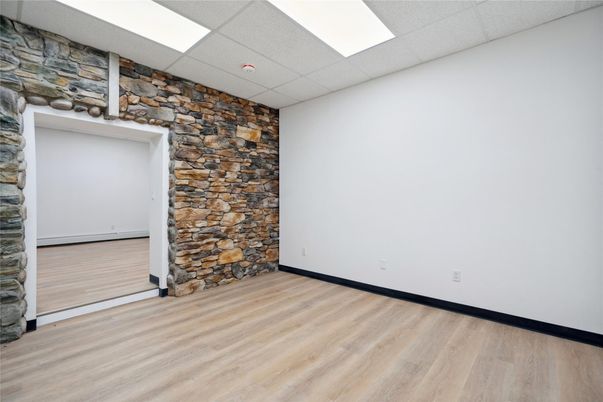 Empty room, Interior, Recessed Lighting, Stone Walls, Wood Texture Flooring
