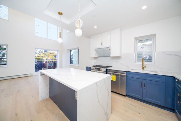 Interior, Kitchen, Marble Walls, Pendant Lights, Recessed Lighting, Stainless Steel Appliances, Wood Texture Flooring