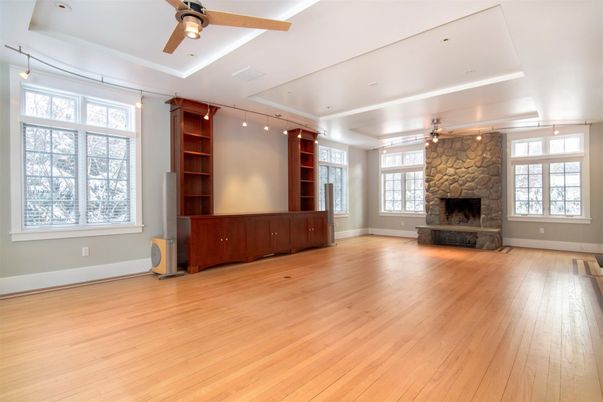 Empty room, Fireplace, Interior, Recessed Lighting, Stone Walls, Wood Texture Flooring