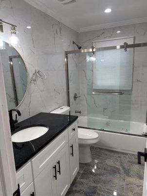 Bathroom, Dual Sink Vanities, Glass Shower, Interior, Marble Walls, Recessed Lighting