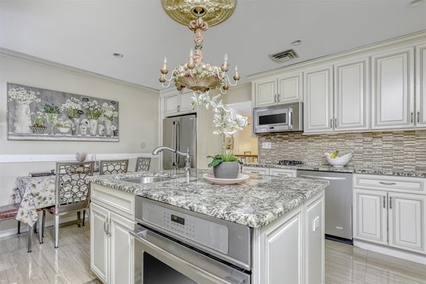 Chandelier, Dining room, Interior, Kitchen, Recessed Lighting, Stainless Steel Appliances, Wood Texture Flooring