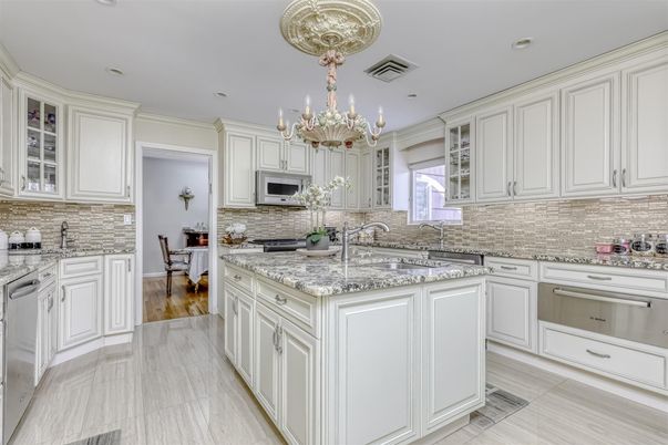 Chandelier, Dining room, Interior, Kitchen, Recessed Lighting, Stainless Steel Appliances, Wood Texture Flooring