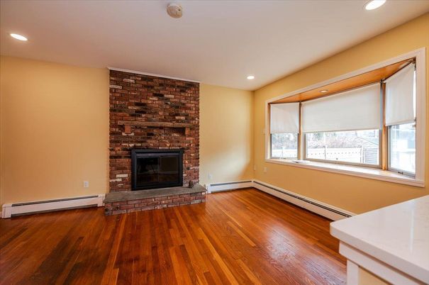 Empty room, Fireplace, Interior, Recessed Lighting, Stone Walls, Wood Texture Flooring
